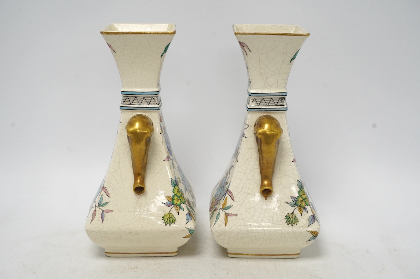 A pair of Christopher Dresser Old Hall crackleware Japanese inspired vases with gilt decorated elephant handles, 24cm high. Condition - good